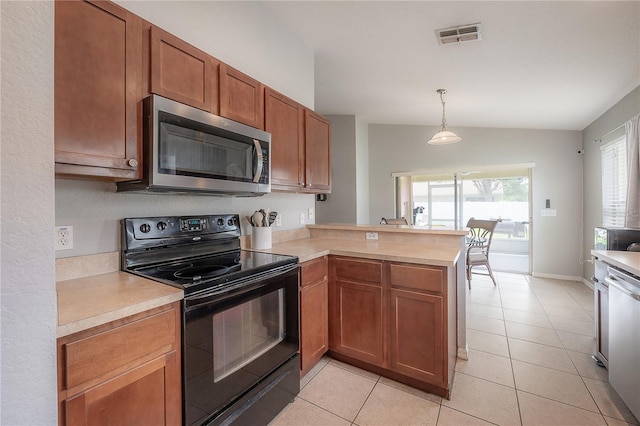 14614 Rannoch Moor Pl, Wimauma, FL 33598 - kitchen with appliances with stainless steel finishes, vaulted ceiling, a peninsula, light countertops, and brown cabinets
