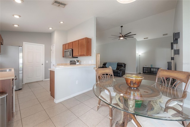 14614 Rannoch Moor Pl, Wimauma, FL 33598 - dining room featuring ceiling fan, vaulted ceiling, light tile patterned flooring, and recessed lighting