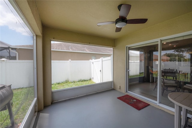 14614 Rannoch Moor Pl, Wimauma, FL 33598 - unfurnished sunroom with ceiling fan