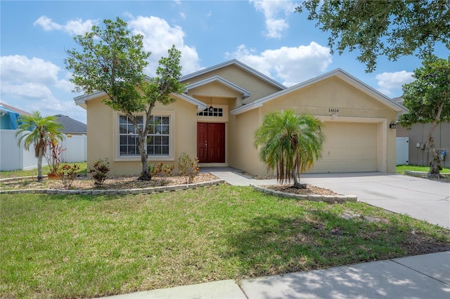 14614 Rannoch Moor Pl, Wimauma, FL 33598 - single story home featuring concrete driveway, a garage, and stucco siding