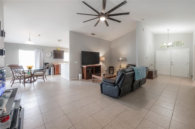 14614 Rannoch Moor Pl, Wimauma, FL 33598 - living area with a chandelier, light tile patterned flooring, a ceiling fan, and lofted ceiling