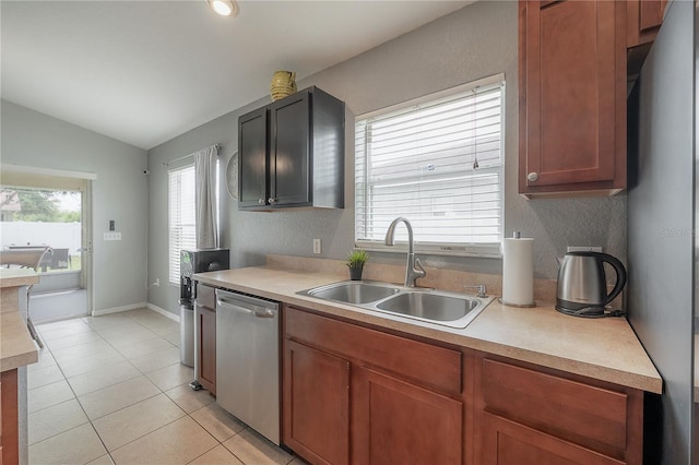 14614 Rannoch Moor Pl, Wimauma, FL 33598 - kitchen with appliances with stainless steel finishes, lofted ceiling, light countertops, and light tile patterned flooring