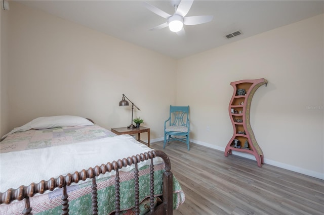 14614 Rannoch Moor Pl, Wimauma, FL 33598 - bedroom with light wood-style flooring and ceiling fan