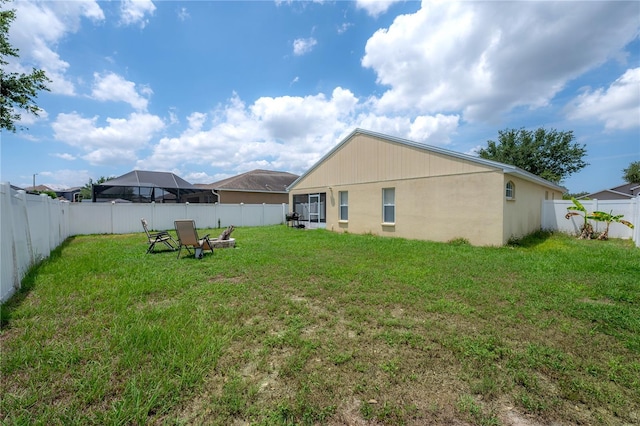 14614 Rannoch Moor Pl, Wimauma, FL 33598 - fenced backyard with a fire pit