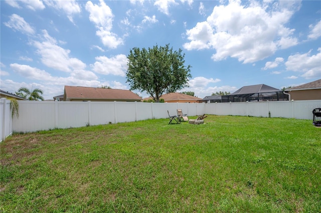 14614 Rannoch Moor Pl, Wimauma, FL 33598 - fenced backyard with an outdoor fire pit