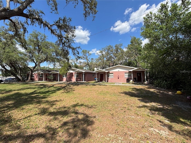 5901 E Gibson Ave, Tampa, FL 33617 - view of green lawn featuring a porch
