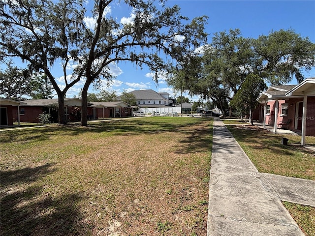 5901 E Gibson Ave, Tampa, FL 33617 - view of green lawn featuring a residential view