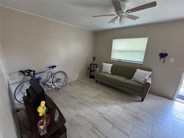 5901 E Gibson Ave, Tampa, FL 33617 - living area featuring a ceiling fan and a textured ceiling