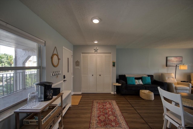 entryway featuring wood finished floors, a textured ceiling, and recessed lighting