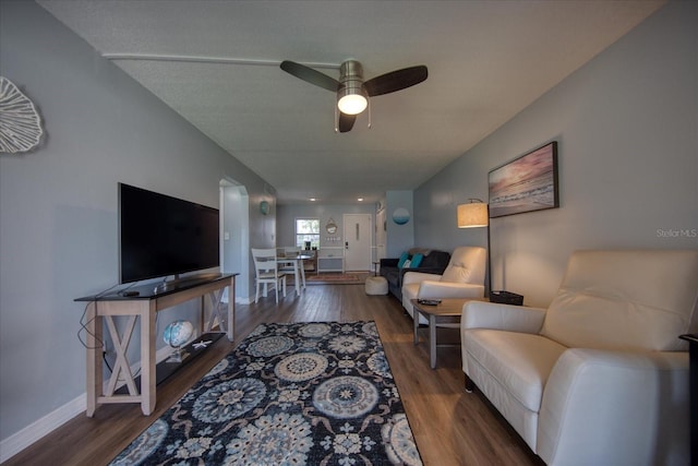 living room featuring wood finished floors, ceiling fan, and baseboards