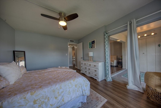 bedroom featuring dark wood-type flooring and a ceiling fan