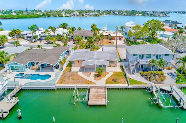 365 La Hacienda Dr, Indian Rocks Beach, FL 33785 - aerial perspective of suburban area featuring a large body of water and a pool area