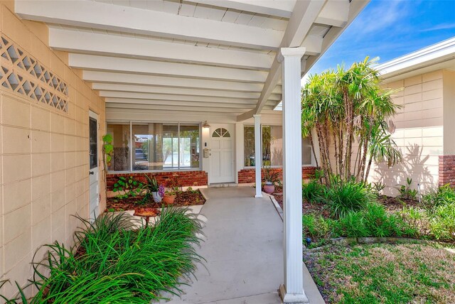 365 La Hacienda Dr, Indian Rocks Beach, FL 33785 - view of patio with a porch