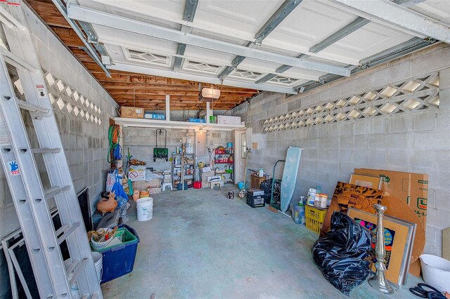 365 La Hacienda Dr, Indian Rocks Beach, FL 33785 - garage with a garage door opener and concrete block wall