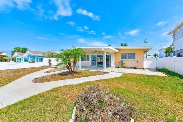 365 La Hacienda Dr, Indian Rocks Beach, FL 33785 - rear view of property with a ceiling fan, stucco siding, a gate, and concrete driveway