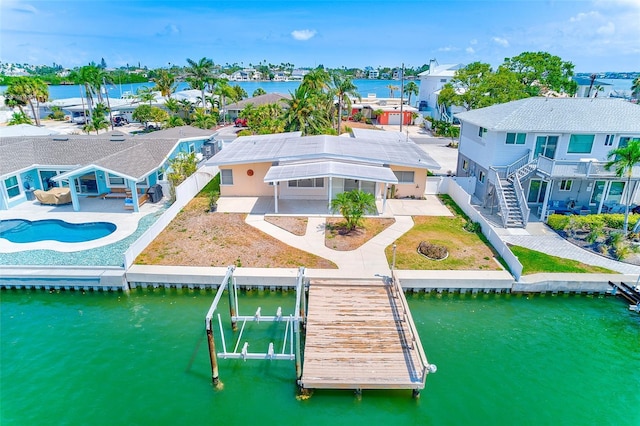 365 La Hacienda Dr, Indian Rocks Beach, FL 33785 - aerial perspective of suburban area with a nearby body of water and a pool area