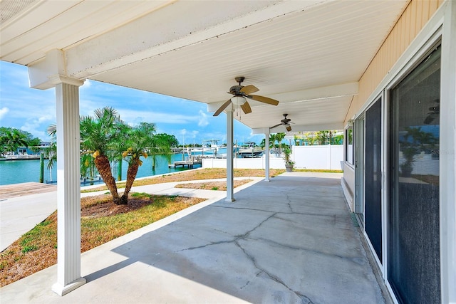 365 La Hacienda Dr, Indian Rocks Beach, FL 33785 - view of patio / terrace with a water view and a ceiling fan