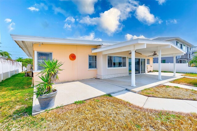 365 La Hacienda Dr, Indian Rocks Beach, FL 33785 - rear view of house featuring ceiling fan and a patio