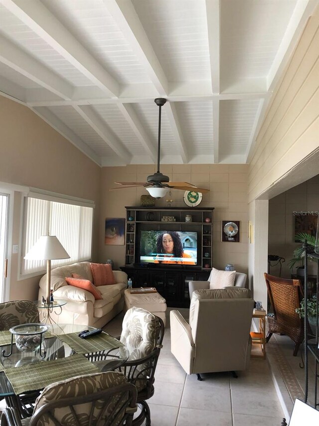 365 La Hacienda Dr, Indian Rocks Beach, FL 33785 - living area featuring light tile patterned floors, a ceiling fan, and wooden walls