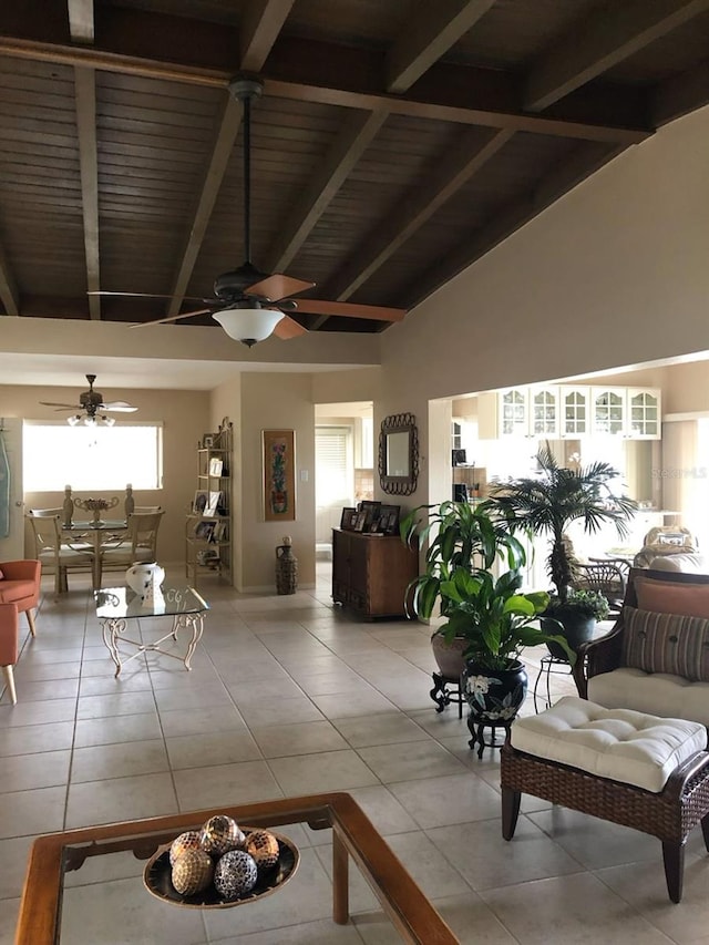 365 La Hacienda Dr, Indian Rocks Beach, FL 33785 - living room featuring a ceiling fan, light tile patterned floors, beam ceiling, high vaulted ceiling, and wood ceiling