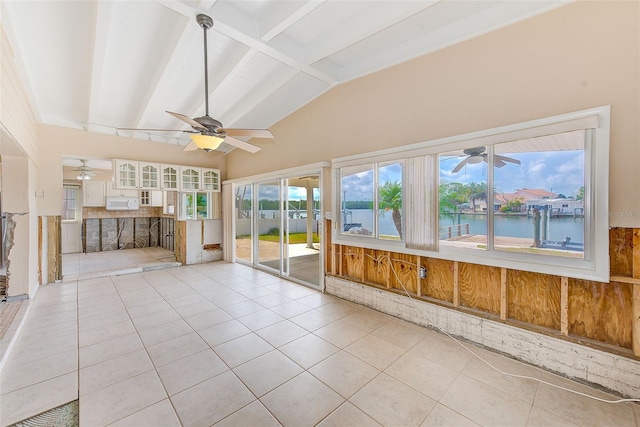 365 La Hacienda Dr, Indian Rocks Beach, FL 33785 - unfurnished sunroom with beam ceiling, tile patterned floors, a water view, and high vaulted ceiling