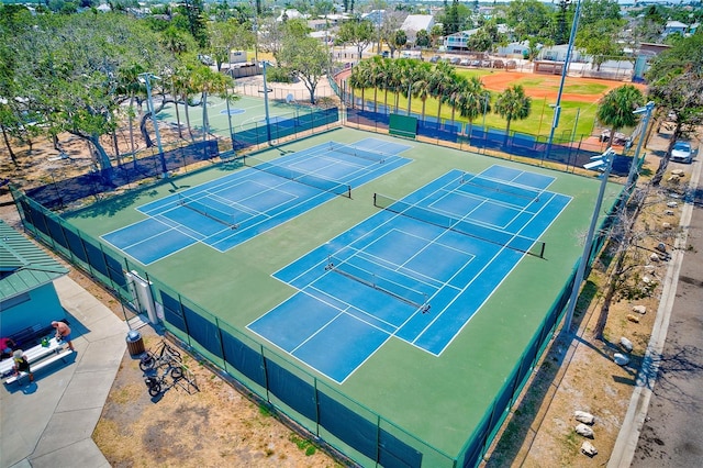 365 La Hacienda Dr, Indian Rocks Beach, FL 33785 - view of tennis court with fence