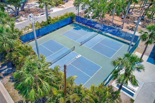 365 La Hacienda Dr, Indian Rocks Beach, FL 33785 - view of tennis court with fence