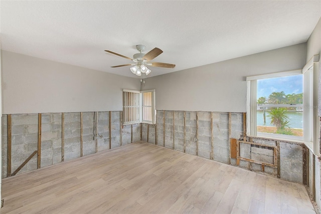 365 La Hacienda Dr, Indian Rocks Beach, FL 33785 - empty room with wood finished floors and ceiling fan