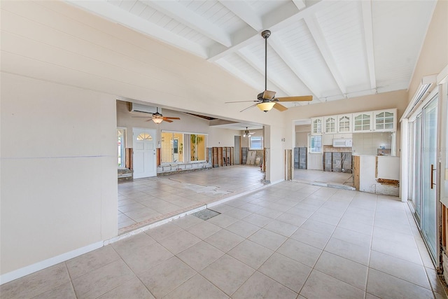365 La Hacienda Dr, Indian Rocks Beach, FL 33785 - unfurnished living room featuring a ceiling fan, light tile patterned floors, and a wall unit AC