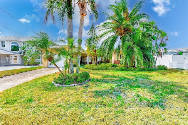 365 La Hacienda Dr, Indian Rocks Beach, FL 33785 - view of front facade featuring driveway and a garage