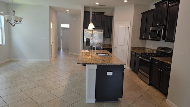 1022 Oliveto Verdi Ct, Brandon, FL 33511 - kitchen featuring appliances with stainless steel finishes, a sink, stone counters, recessed lighting, and light tile patterned floors