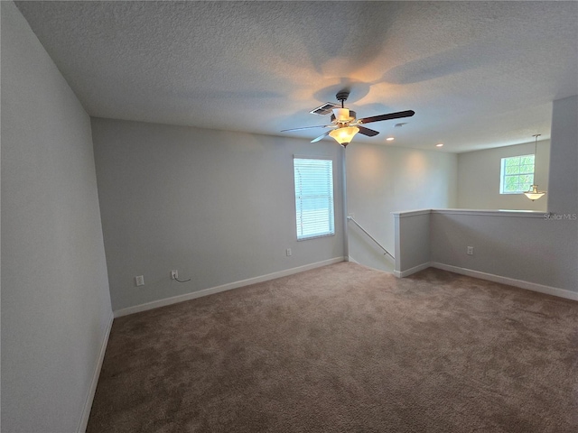 1022 Oliveto Verdi Ct, Brandon, FL 33511 - carpeted spare room featuring baseboards, a textured ceiling, and ceiling fan