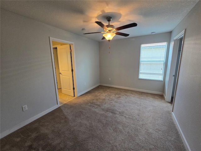 1022 Oliveto Verdi Ct, Brandon, FL 33511 - unfurnished bedroom with carpet floors, baseboards, and a textured ceiling