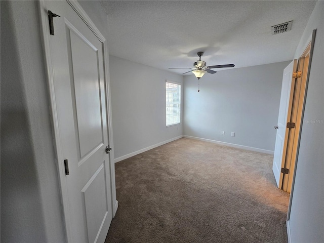 1022 Oliveto Verdi Ct, Brandon, FL 33511 - unfurnished bedroom featuring carpet floors, baseboards, a ceiling fan, and a textured ceiling