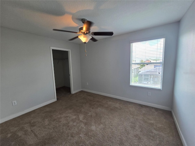 1022 Oliveto Verdi Ct, Brandon, FL 33511 - unfurnished bedroom with carpet flooring, a spacious closet, a closet, and ceiling fan
