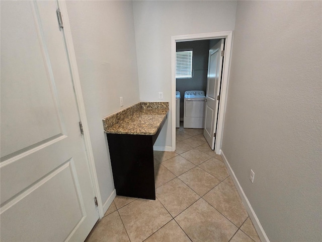 1022 Oliveto Verdi Ct, Brandon, FL 33511 - laundry room featuring independent washer and dryer, light tile patterned floors, and baseboards