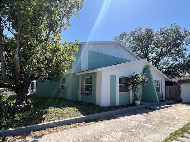 2068 San Marino Way N, Clearwater, FL 33763 - view of side of property featuring stucco siding and fence