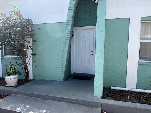 2068 San Marino Way N, Clearwater, FL 33763 - doorway to property with stucco siding