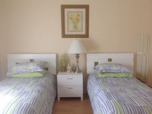 bedroom featuring wood finished floors