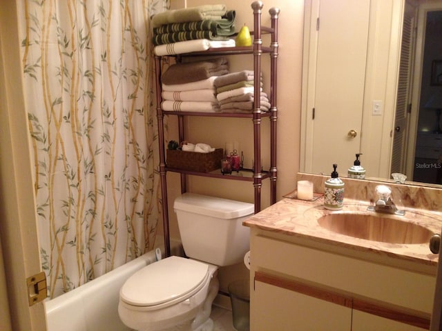 full bathroom with vanity, toilet, and shower / tub combo with curtain