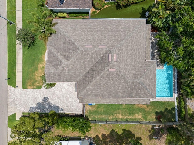 view of subject property with a pool