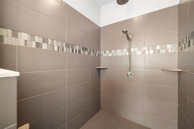 bathroom with tiled shower