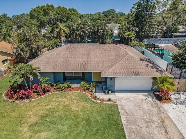 ranch-style home featuring a garage, driveway, a shingled roof, and cooling unit