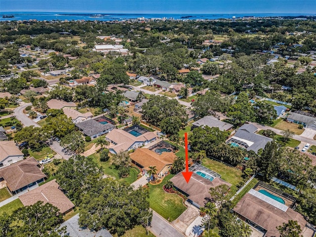 view of property location with a nearby body of water and nearby suburban area