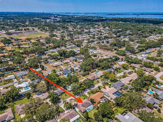 aerial view of property's location with a large body of water