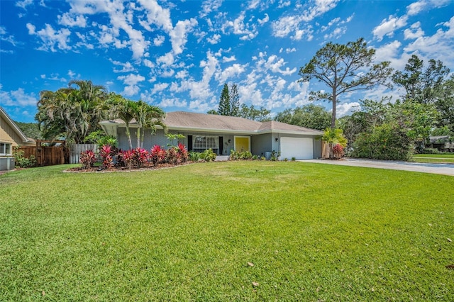 ranch-style house featuring concrete driveway and an attached garage