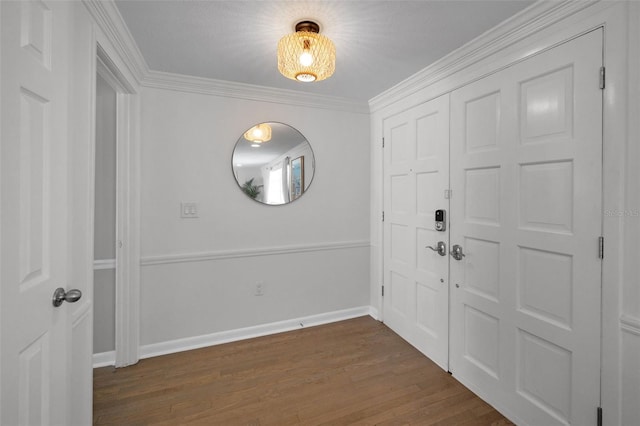 entryway with dark wood-style flooring, baseboards, and ornamental molding