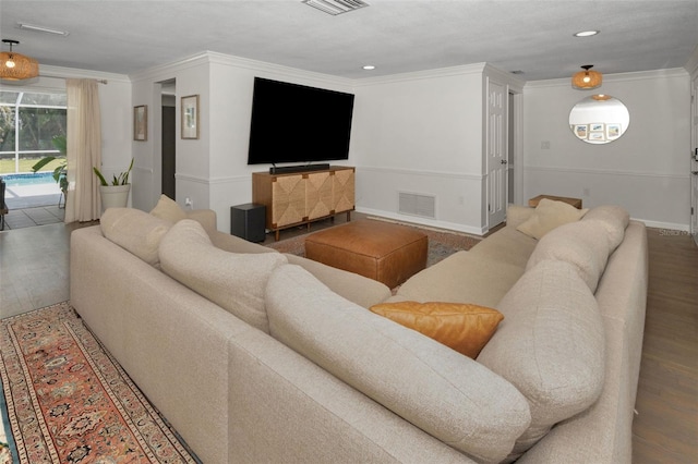 living room featuring crown molding, wood finished floors, and recessed lighting