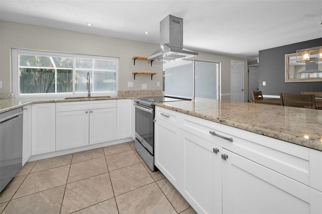 kitchen featuring island range hood, stainless steel appliances, a sink, light stone counters, and white cabinets