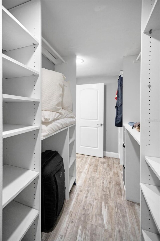 walk in closet featuring light wood-style floors